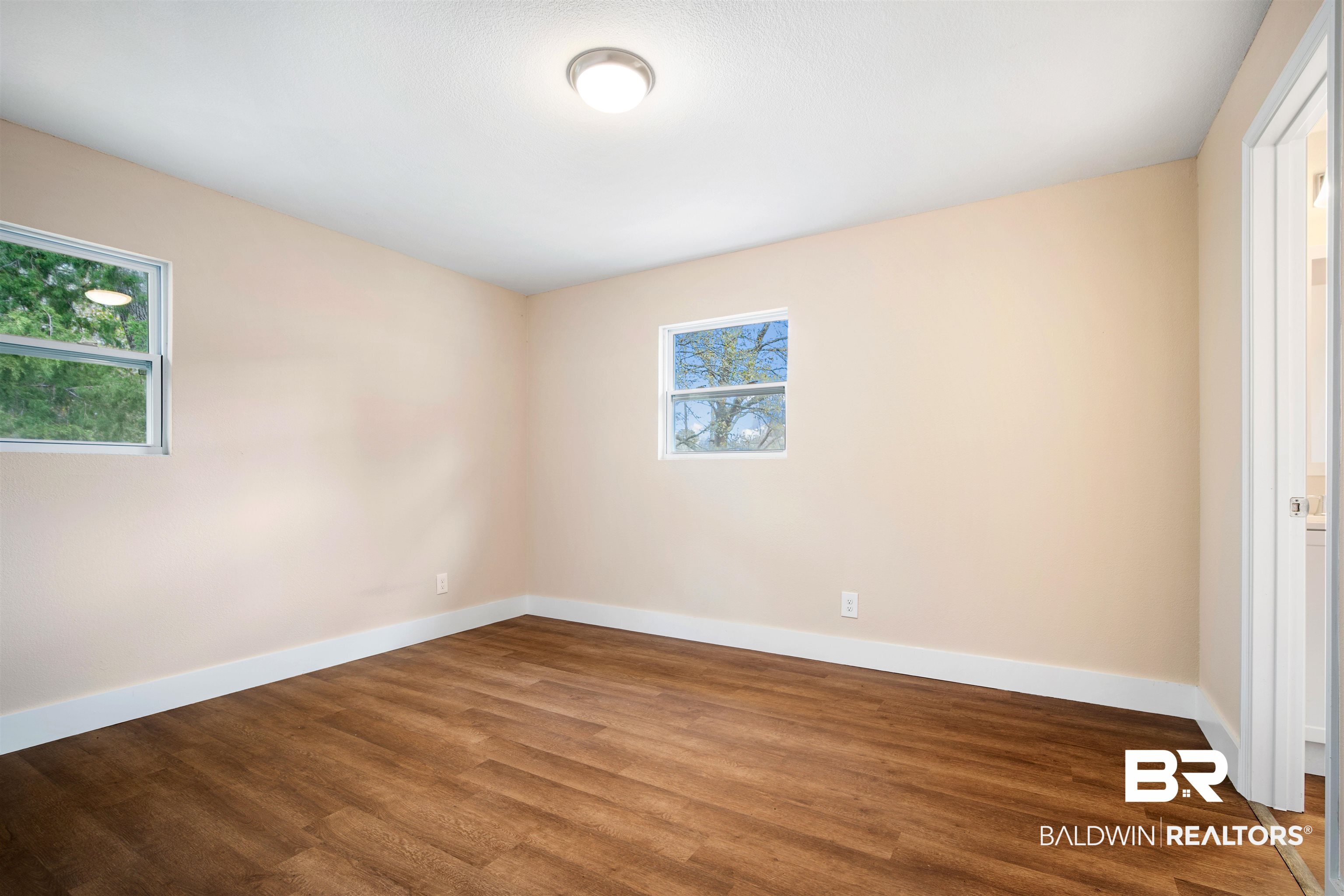 2119 Autrey Avenue Eight Mile, AL 36613 - Photo 11 of 22 Unfurnished room with hardwood / wood-style flooring
