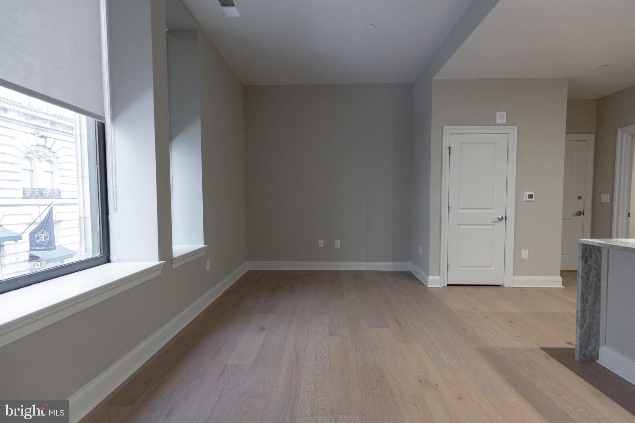 1411-1 Walnut Street, Unit 201 Philadelphia, PA 19102 - Photo 13 of 27 an empty room with a window