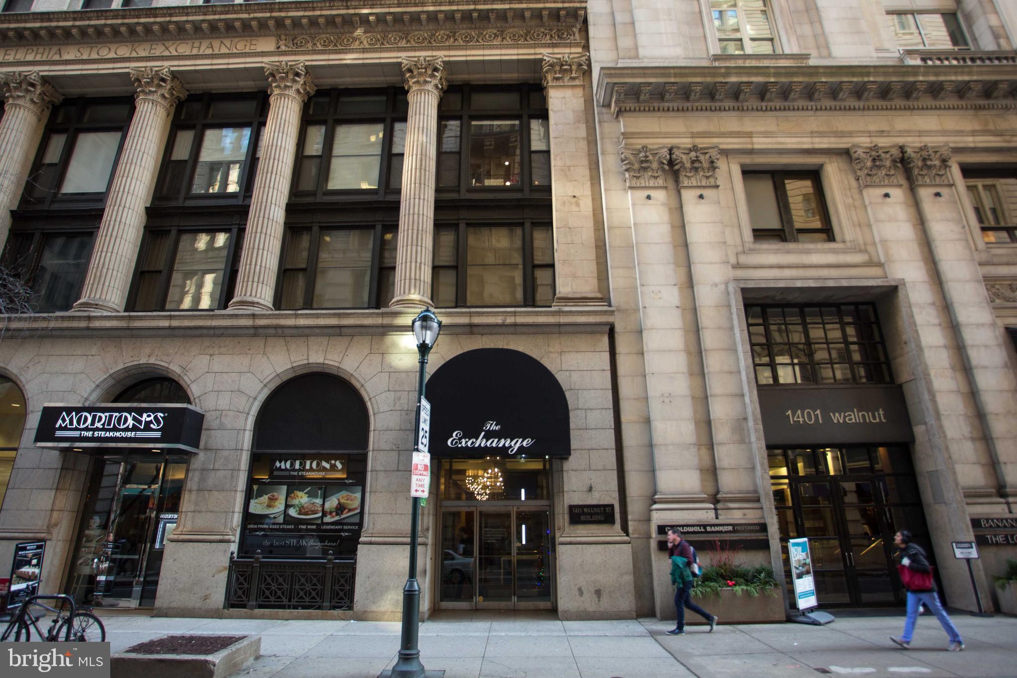 1411-1 Walnut Street, Unit 201 Philadelphia, PA 19102 - Photo 2 of 27 a front view of a building with glass windows
