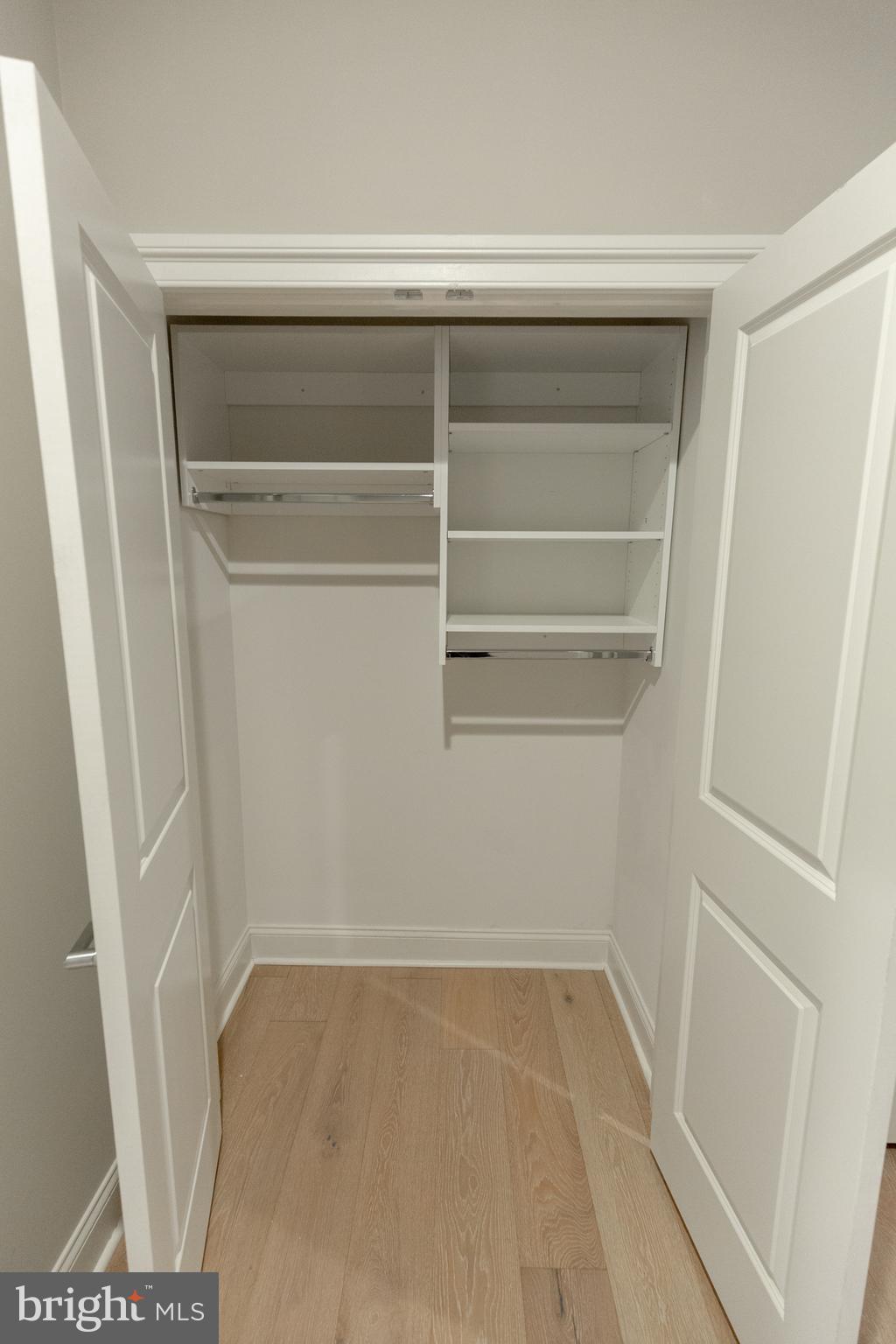 1411-1 Walnut Street, Unit 201 Philadelphia, PA 19102 - Photo 22 of 27 a view of walk in closet with empty racks