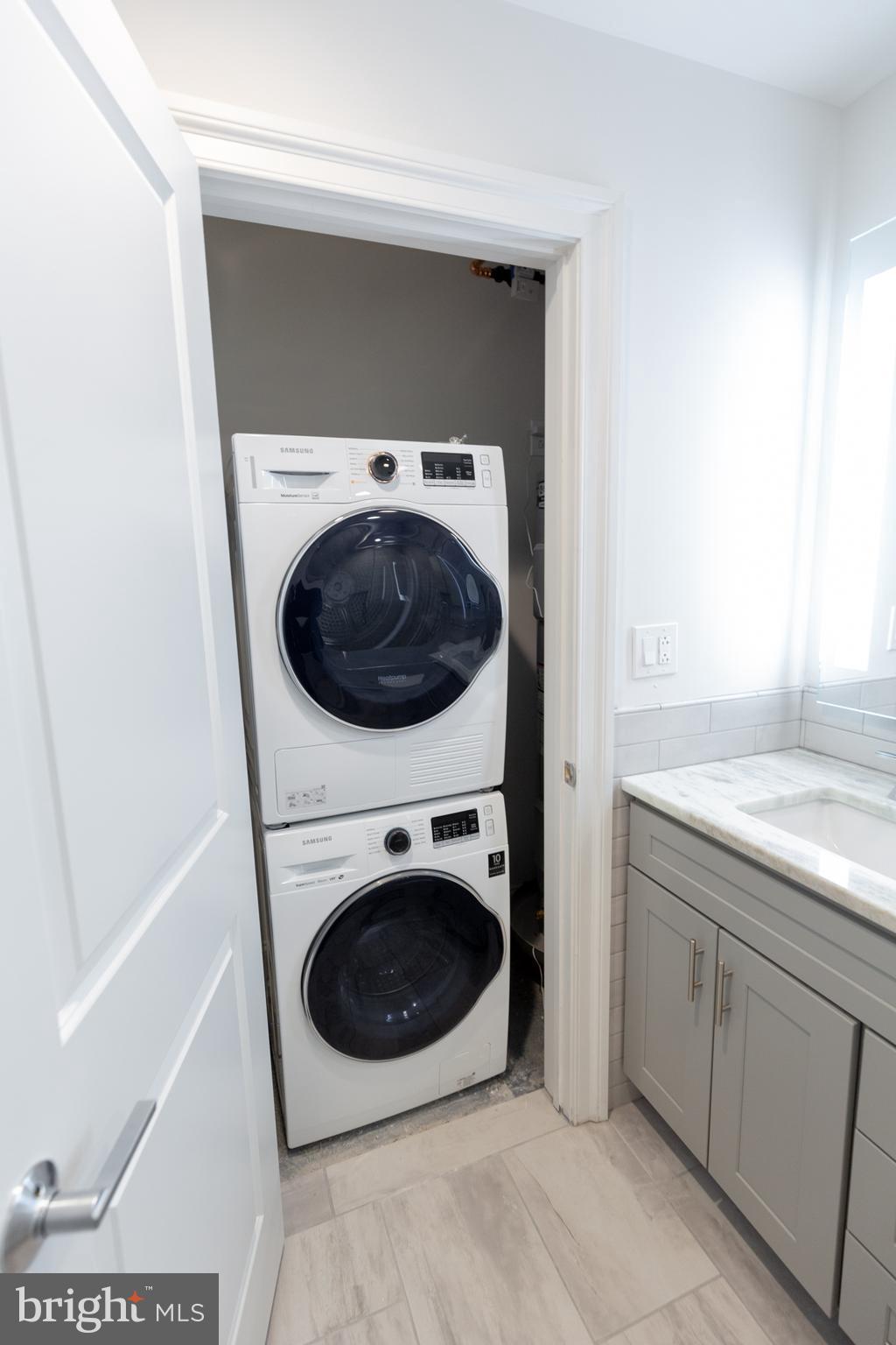 1411-1 Walnut Street, Unit 201 Philadelphia, PA 19102 - Photo 25 of 27 a utility room with dryer and washer