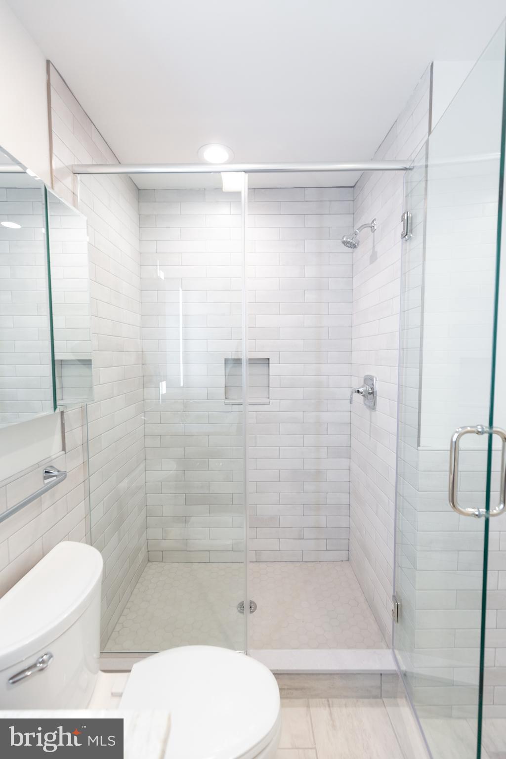 1411-1 Walnut Street, Unit 201 Philadelphia, PA 19102 - Photo 26 of 27 a bathroom with a shower and a toilet