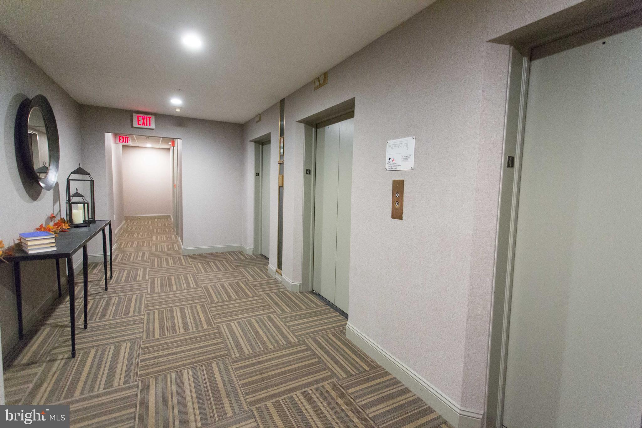 1411-1 Walnut Street, Unit 201 Philadelphia, PA 19102 - Photo 4 of 27 a view of a hallway with wooden floor windows and entryway