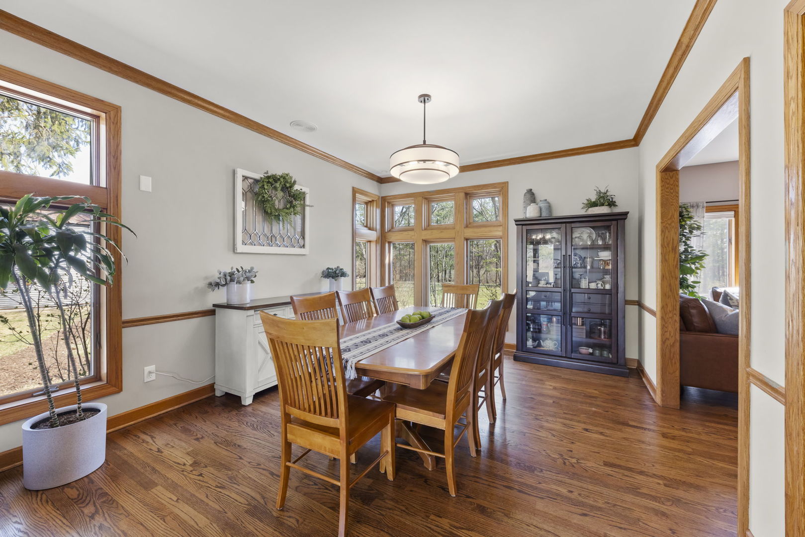 8877 Kennedy Road Yorkville, IL 60560 - Photo 11 of 86 a view of a dining room with furniture window and wooden floor