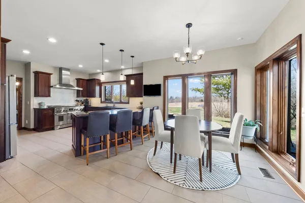 a kitchen with granite countertop a sink and a window