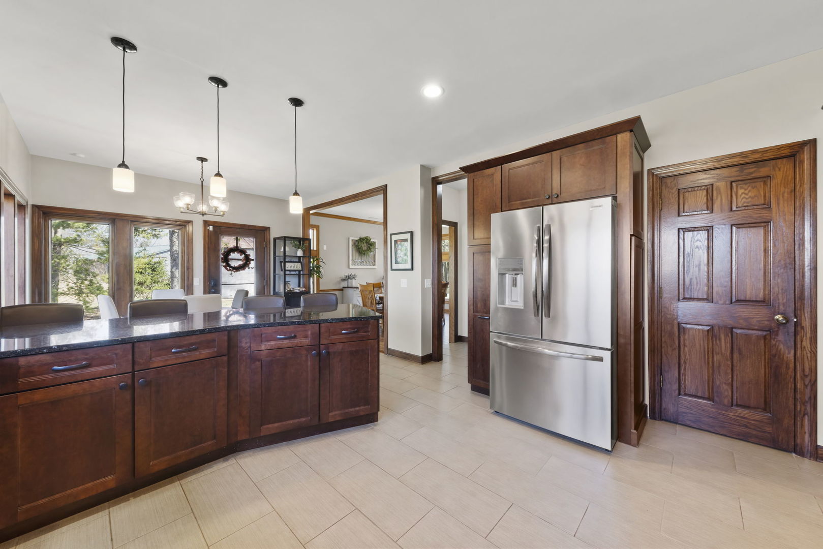 8877 Kennedy Road Yorkville, IL 60560 - Photo 17 of 86 a kitchen with stainless steel appliances granite countertop a refrigerator and a sink