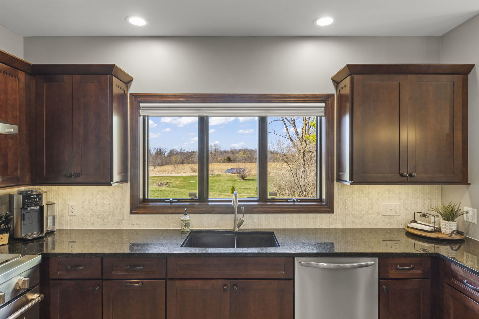8877 Kennedy Road Yorkville, IL 60560 - Photo 19 of 86 a kitchen with granite countertop a sink and a window