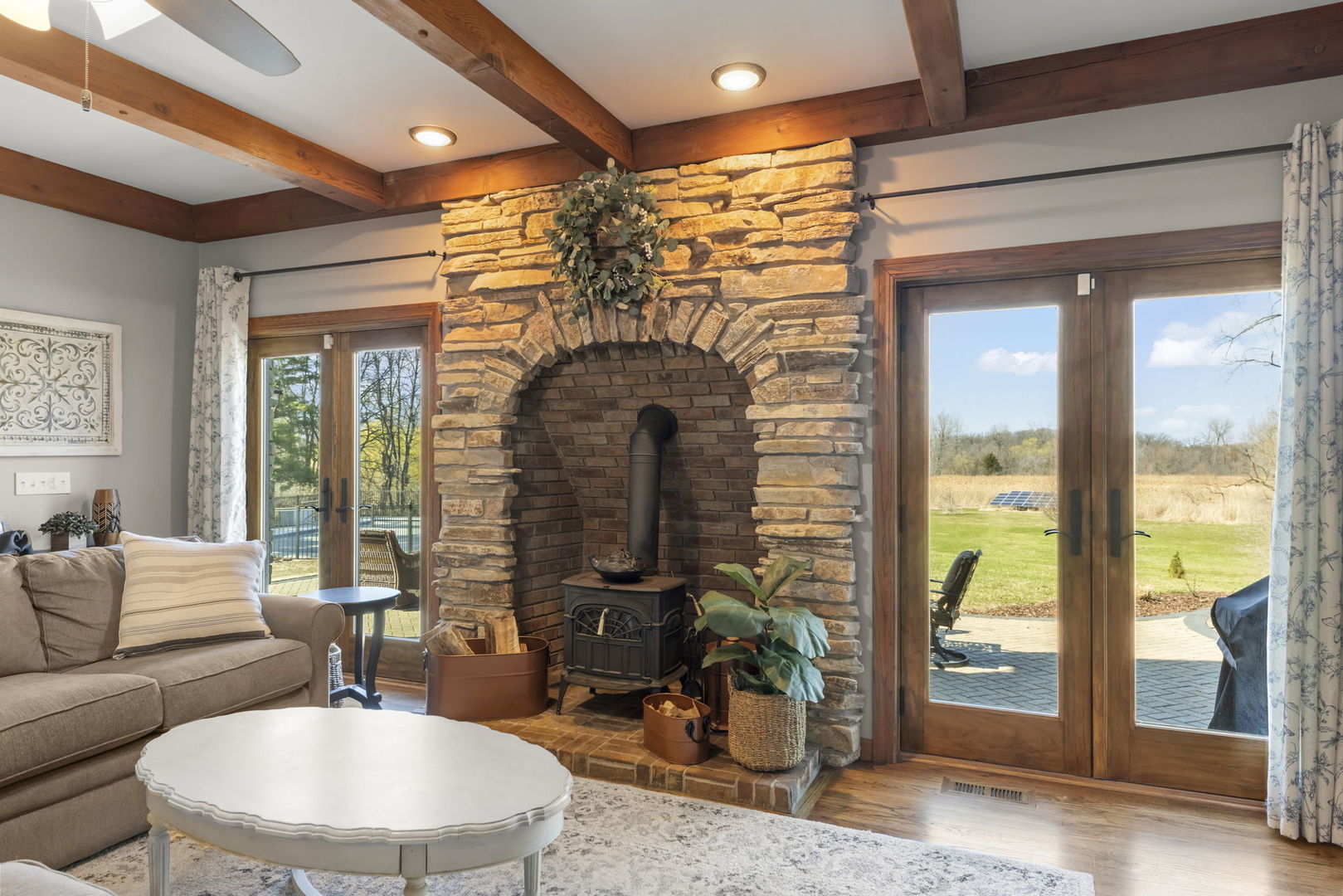 8877 Kennedy Road Yorkville, IL 60560 - Photo 24 of 86 a living room with furniture and a chandelier