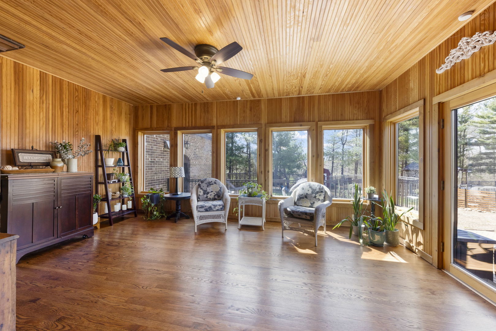 8877 Kennedy Road Yorkville, IL 60560 - Photo 25 of 86 a living room with furniture and floor to ceiling windows