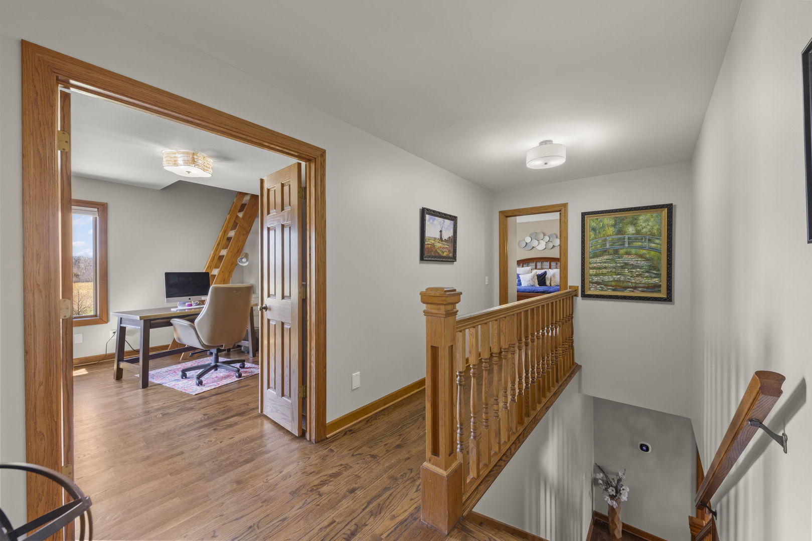 8877 Kennedy Road Yorkville, IL 60560 - Photo 30 of 86 a view of a hallway with workspace and wooden floor to ceiling window