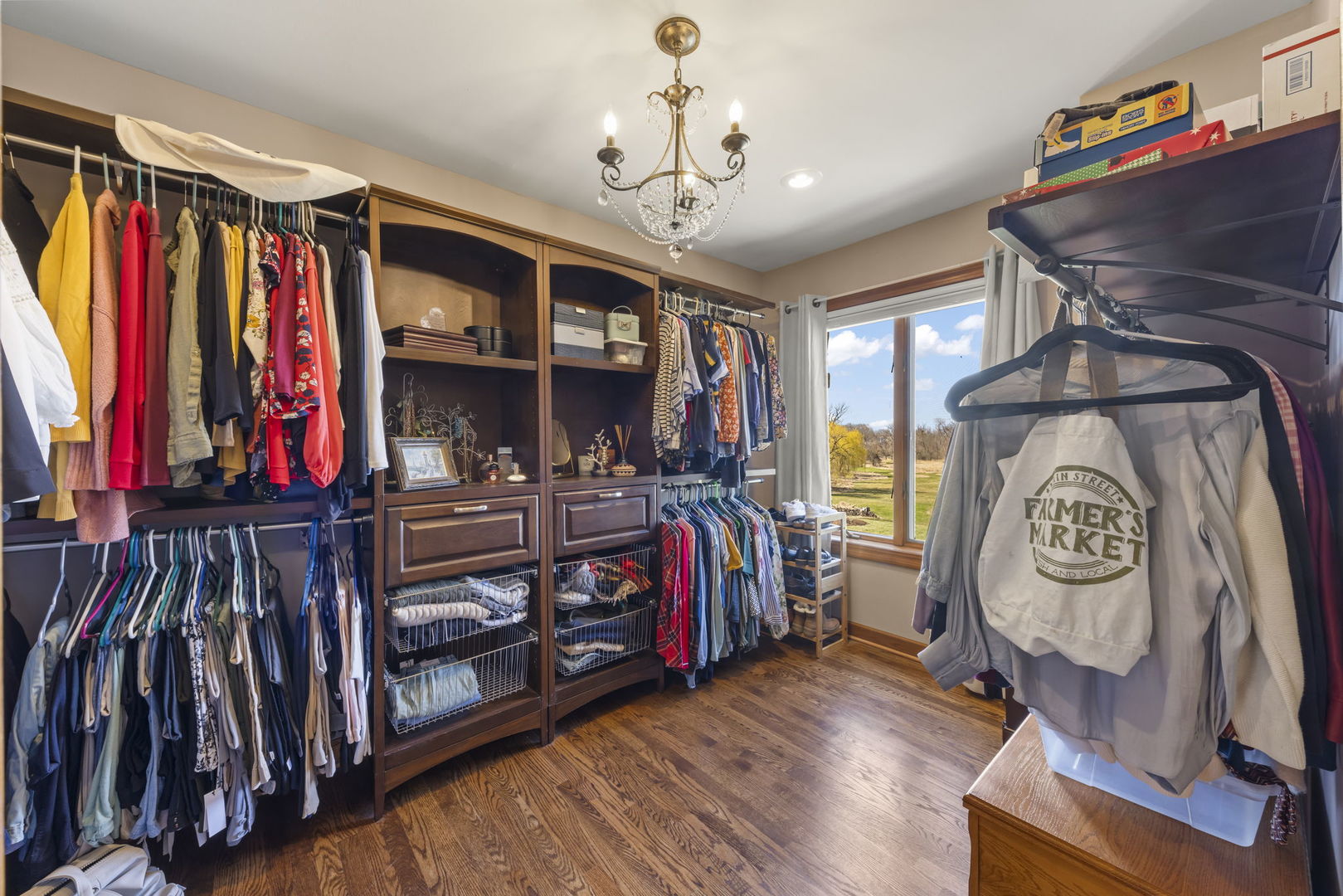 8877 Kennedy Road Yorkville, IL 60560 - Photo 34 of 86 a view of walk in closet with clothes and shoes