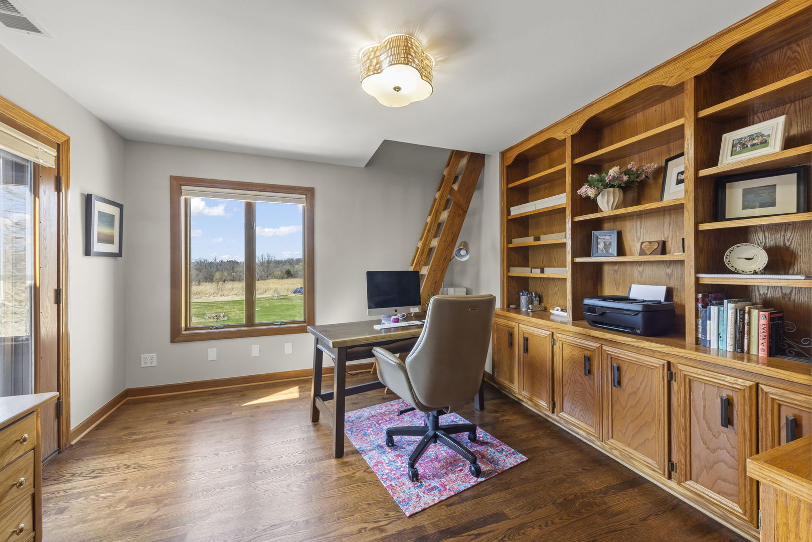 8877 Kennedy Road Yorkville, IL 60560 - Photo 45 of 86 a view of a workspace with furniture and a window