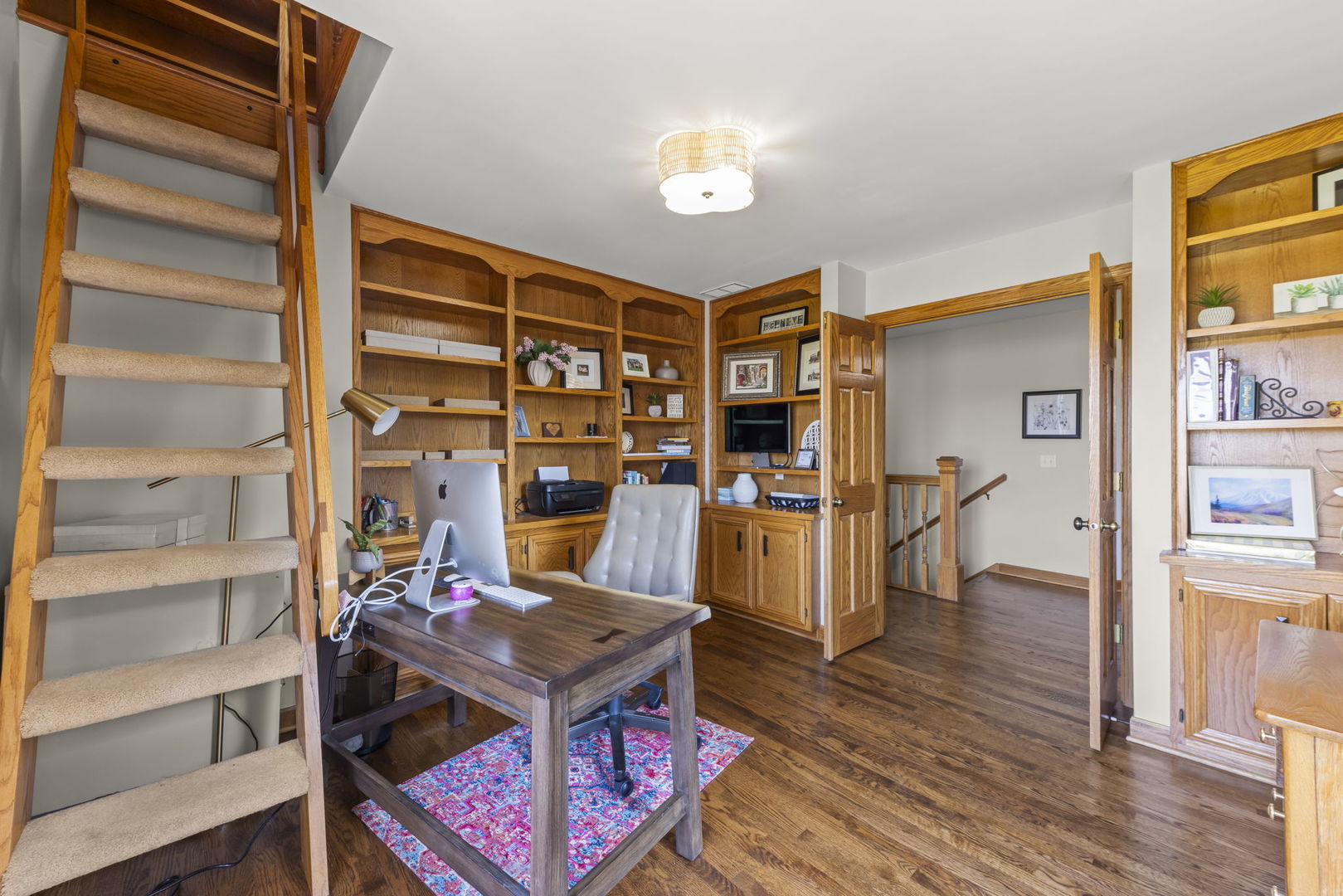 8877 Kennedy Road Yorkville, IL 60560 - Photo 48 of 86 a living room with furniture a rug and a bookshelf