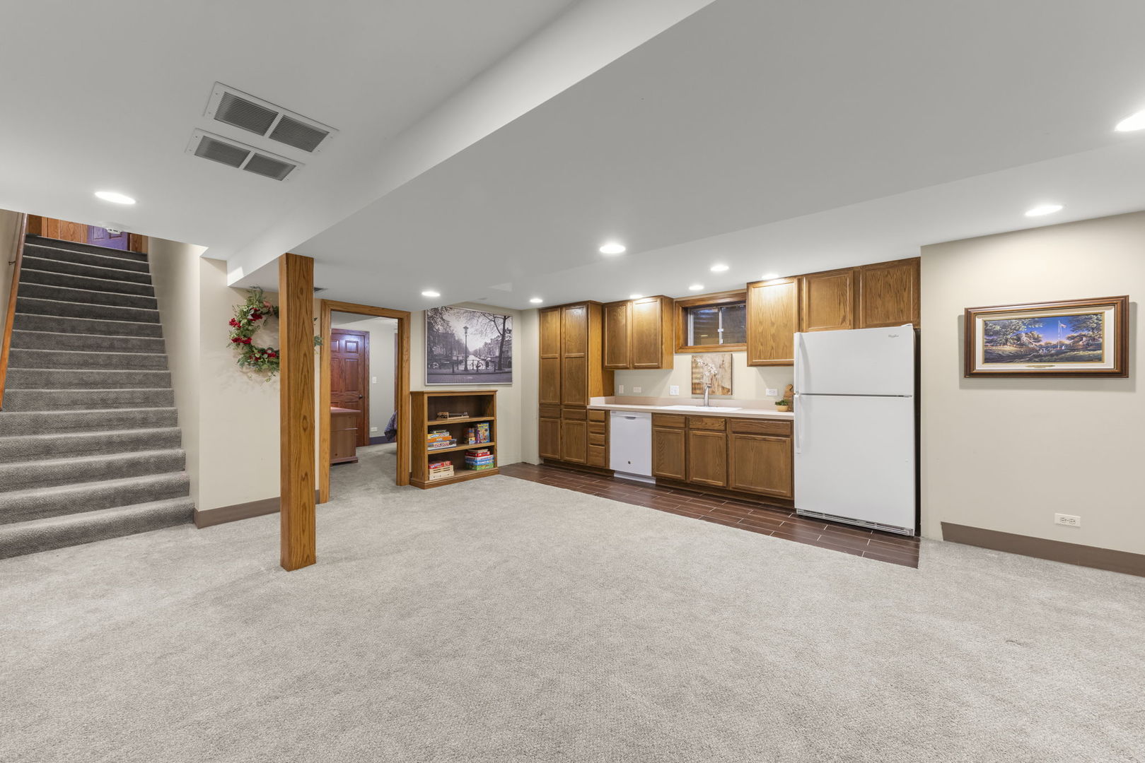 8877 Kennedy Road Yorkville, IL 60560 - Photo 50 of 86 a view of a livingroom with furniture and a refrigerator