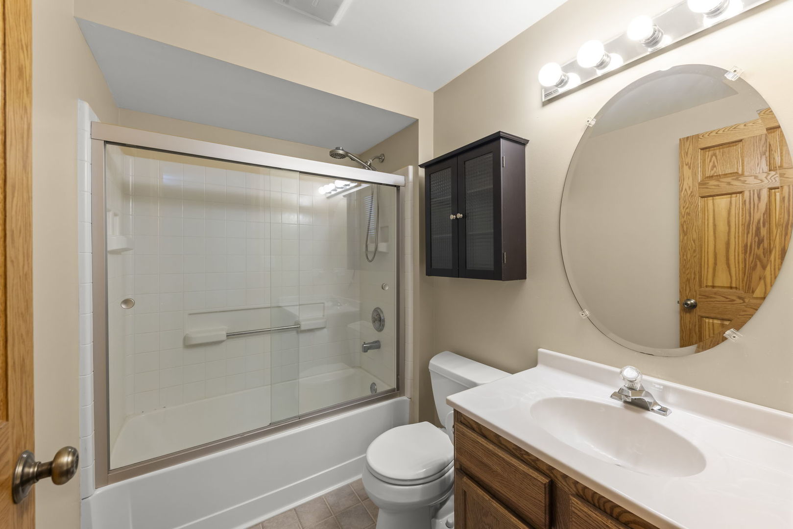 8877 Kennedy Road Yorkville, IL 60560 - Photo 55 of 86 a bathroom with a sink a toilet and shower