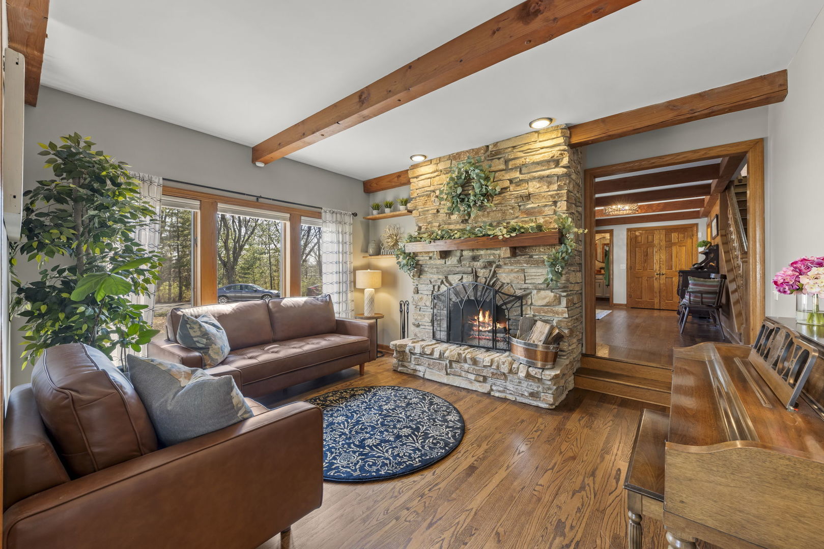 8877 Kennedy Road Yorkville, IL 60560 - Photo 9 of 86 a living room with furniture and a fireplace