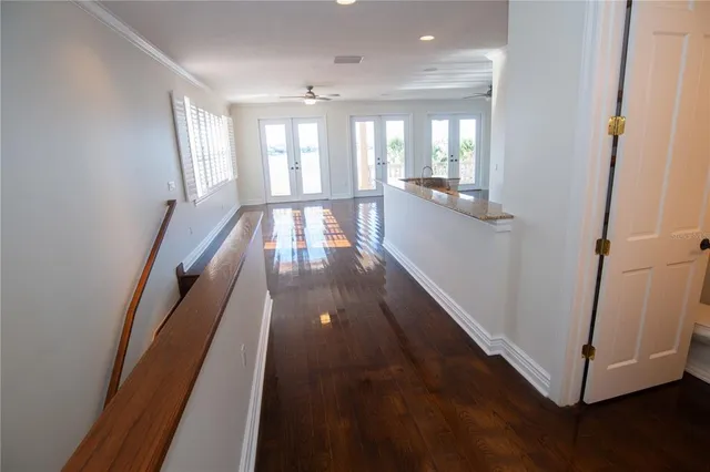 a view of gallery with wooden floor