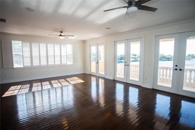 a view of an entryway with wooden floor