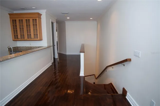 a view of front door and hallway with wooden floor