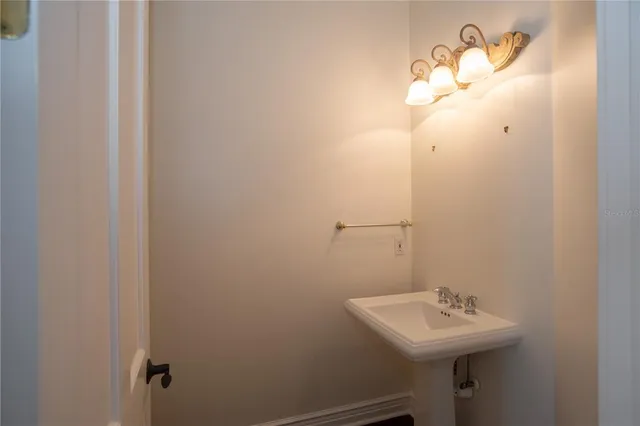 a bathroom with a sink and mirror