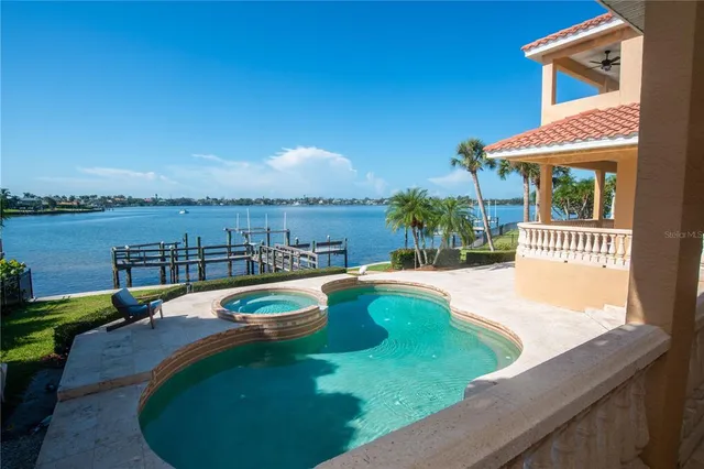 swimming pool view with a seating space