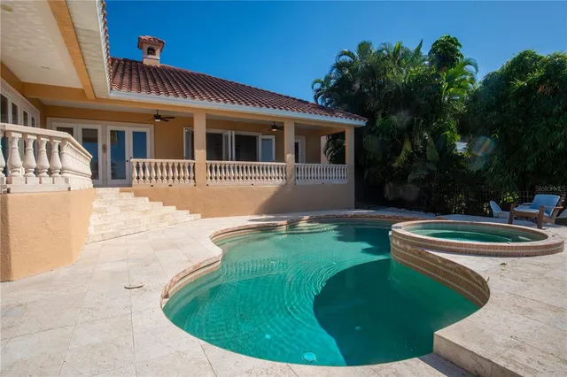 a front view of a house with a yard table and chairs