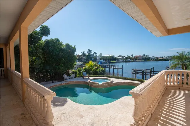 a view of a swimming pool with a patio