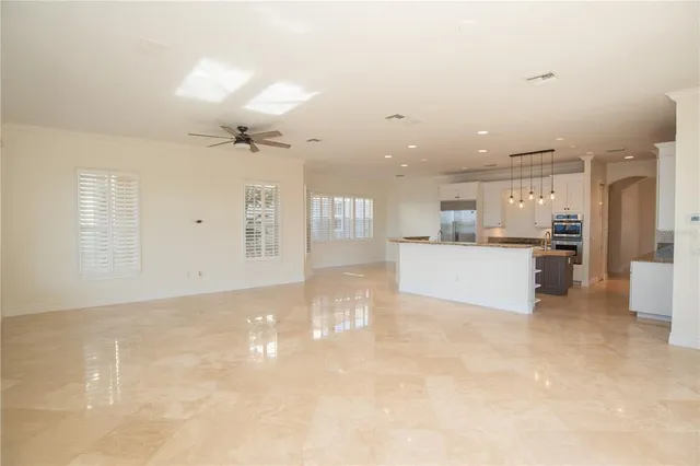 a view of a kitchen with a sink and cabinets