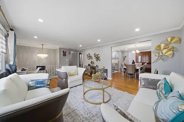 a living room with furniture and a gym