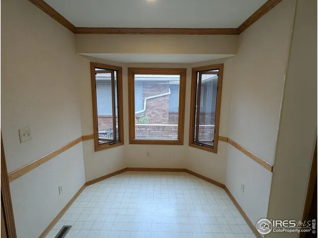 a kitchen with wooden cabinets and a stove top oven