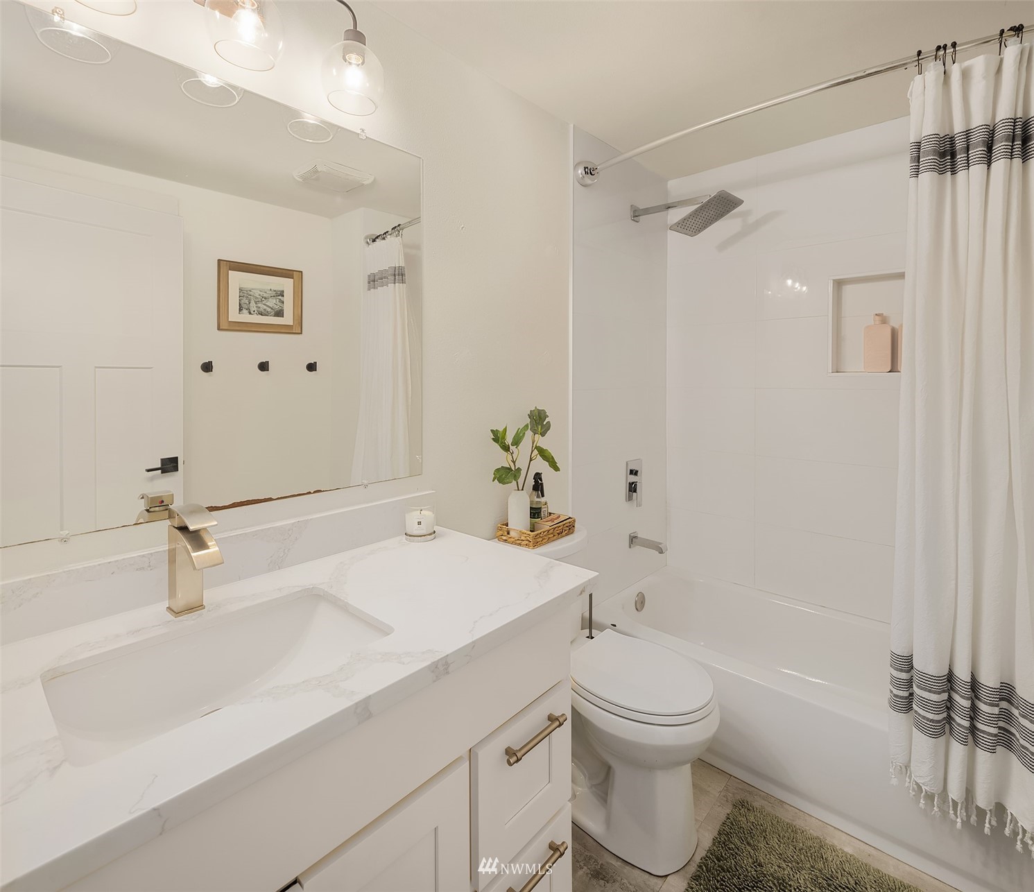 3115 Southeast 5th Street Renton, WA 98058 - Photo 19 of 25 a bathroom with a sink a toilet and shower