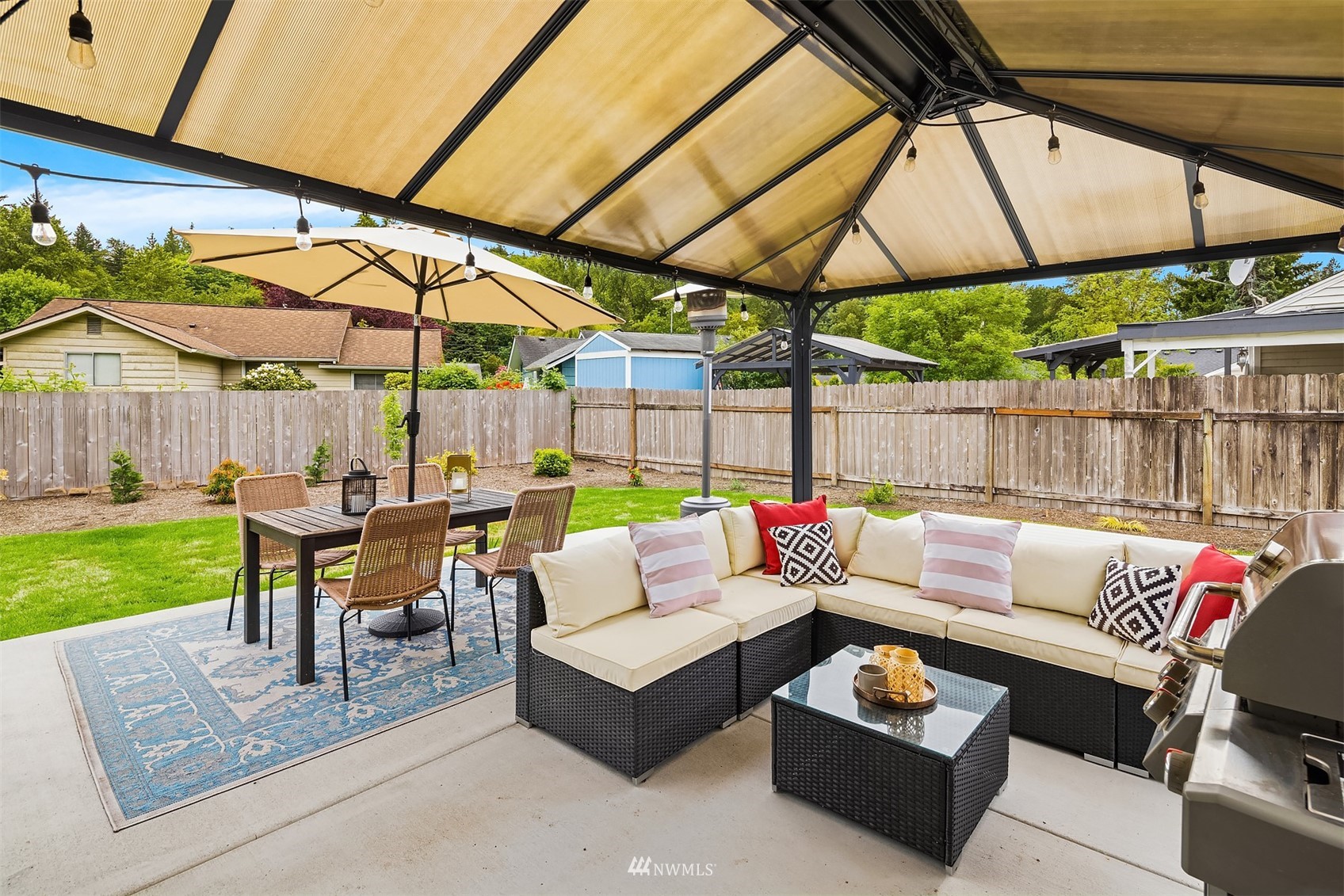 3115 Southeast 5th Street Renton, WA 98058 - Photo 20 of 25 a outdoor living space with patio furniture and a garden