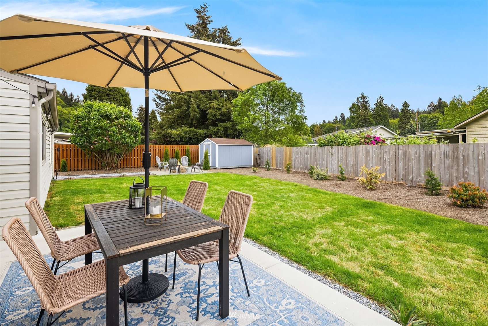 3115 Southeast 5th Street Renton, WA 98058 - Photo 21 of 25 a view of an chairs and table in the yard