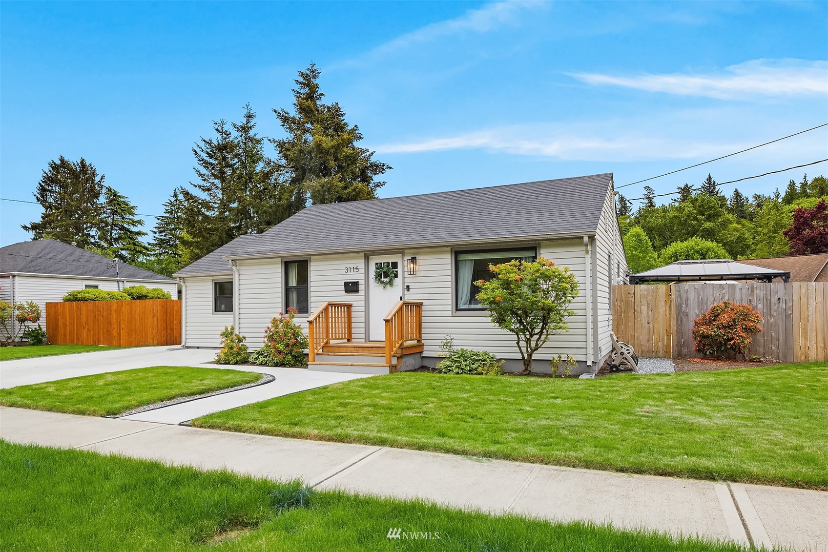 3115 Southeast 5th Street Renton, WA 98058 - Photo 3 of 25 a front view of house with yard and green space