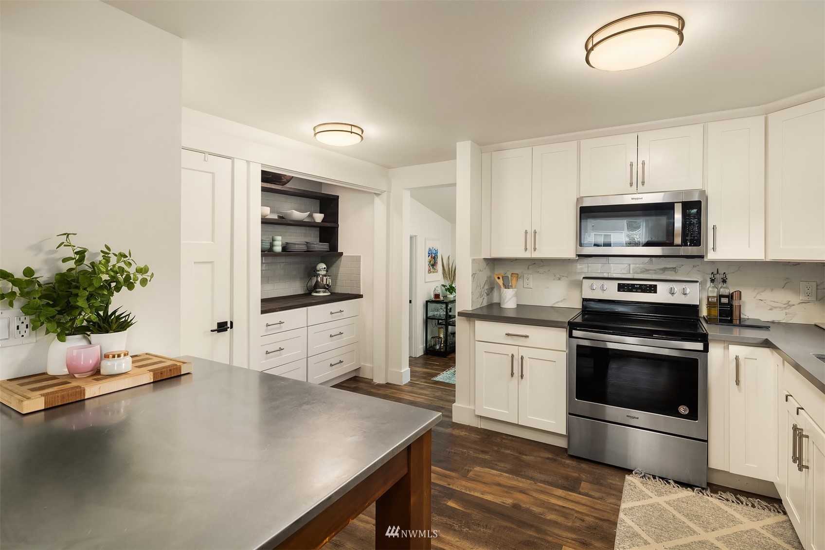 3115 Southeast 5th Street Renton, WA 98058 - Photo 10 of 25 a kitchen with a sink cabinets and stainless steel appliances