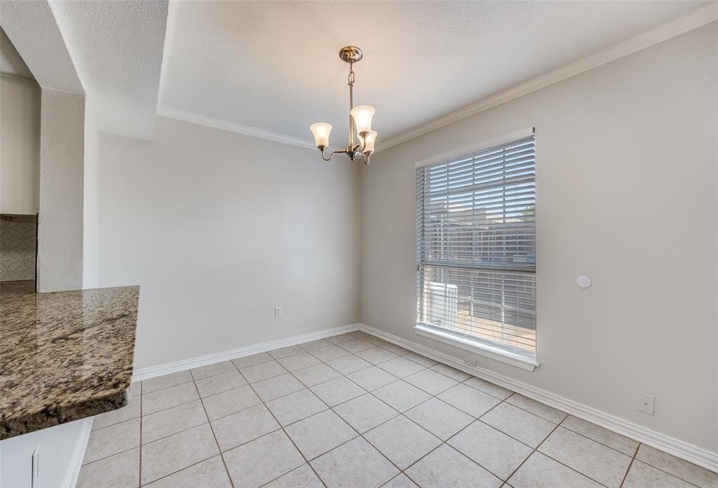 13220 Woodbend Lane Dallas, TX 75243 - Photo 12 of 26 a view of an empty room with a window
