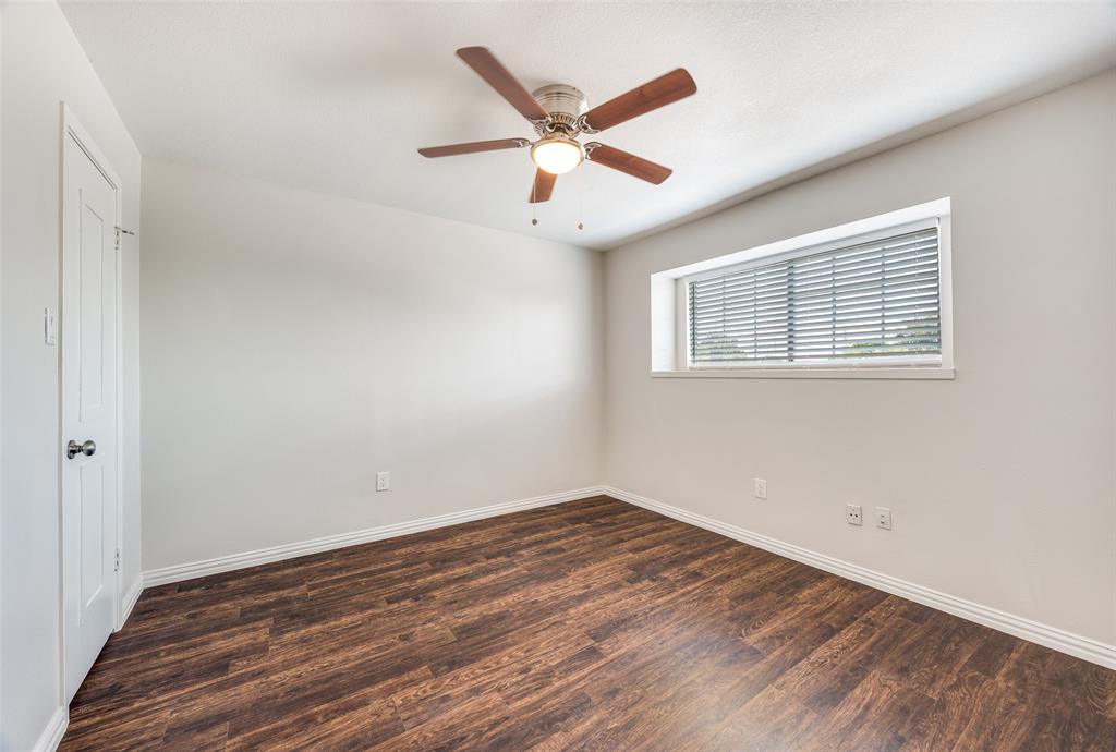 13220 Woodbend Lane Dallas, TX 75243 - Photo 23 of 26 a view of empty room with wooden floor