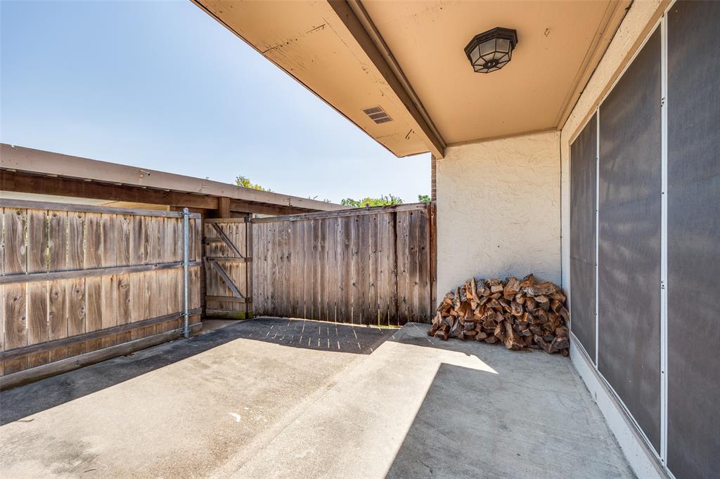 13220 Woodbend Lane Dallas, TX 75243 - Photo 24 of 26 a view of a porch with wooden floor