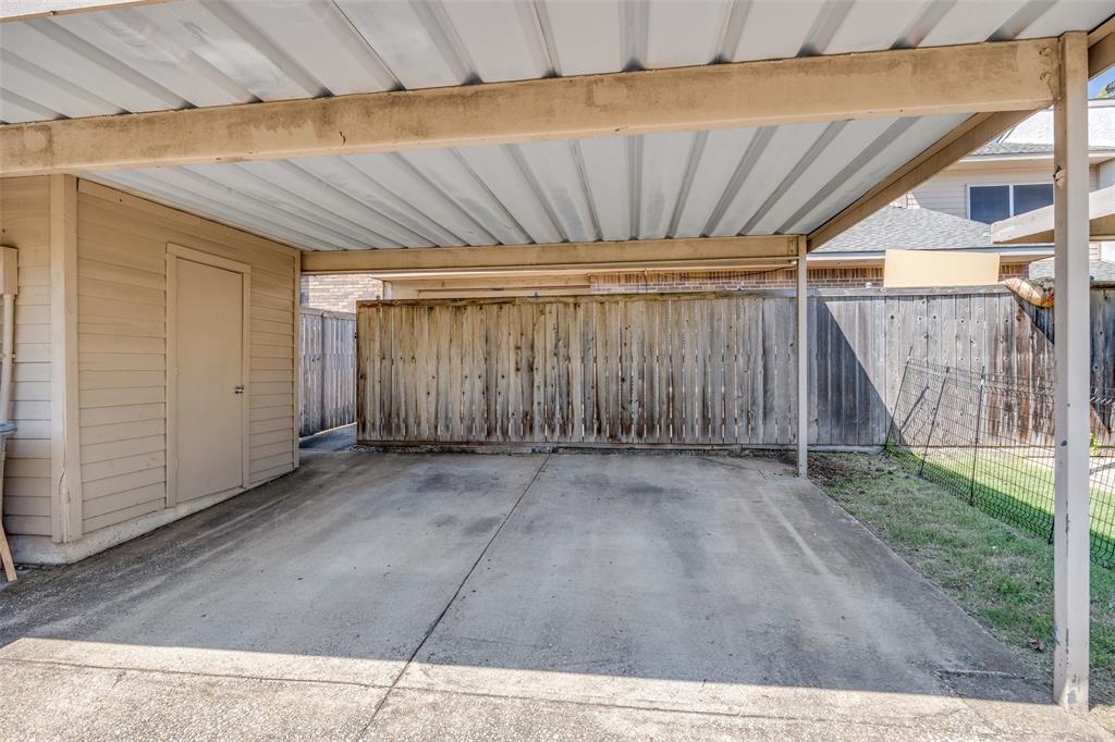 13220 Woodbend Lane Dallas, TX 75243 - Photo 26 of 26 a view of a backyard with wooden fence