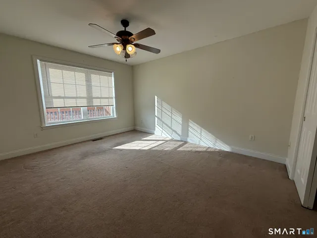 a view of a house with swimming pool and sitting area