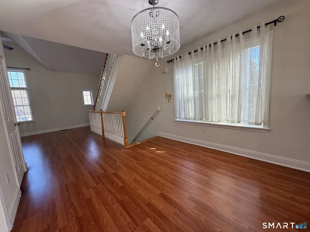 a view of an ocean window and wooden floor