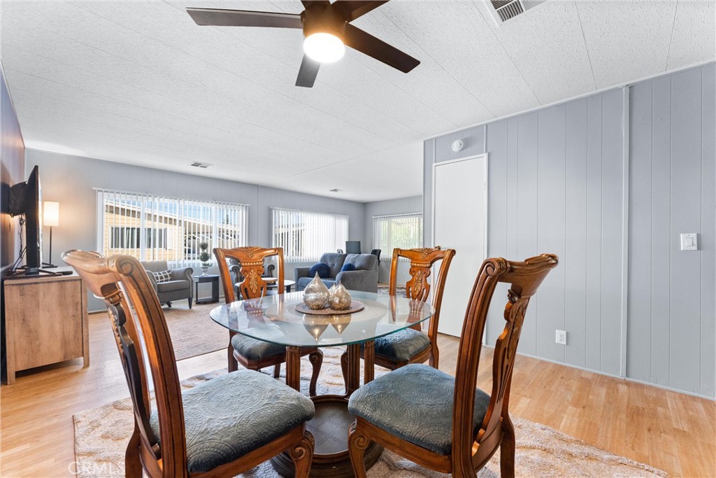 1400 Sunkist, Unit 173 Anaheim, CA 92806 - Photo 42 of 42 Nice flowing floor plan where dining room opens into the sizeable living room.