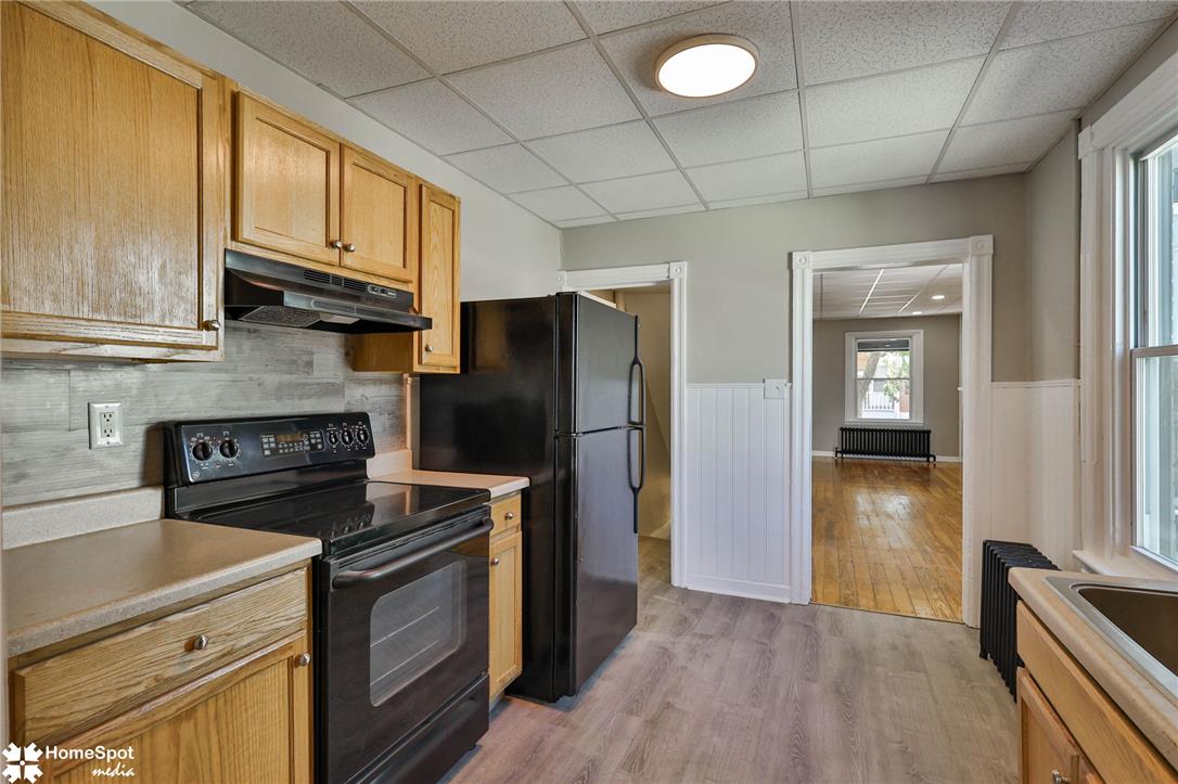 619 Sioux Street Bethlehem, PA 18015 - Photo 22 of 61 a kitchen with stainless steel appliances granite countertop a stove a refrigerator and a microwave