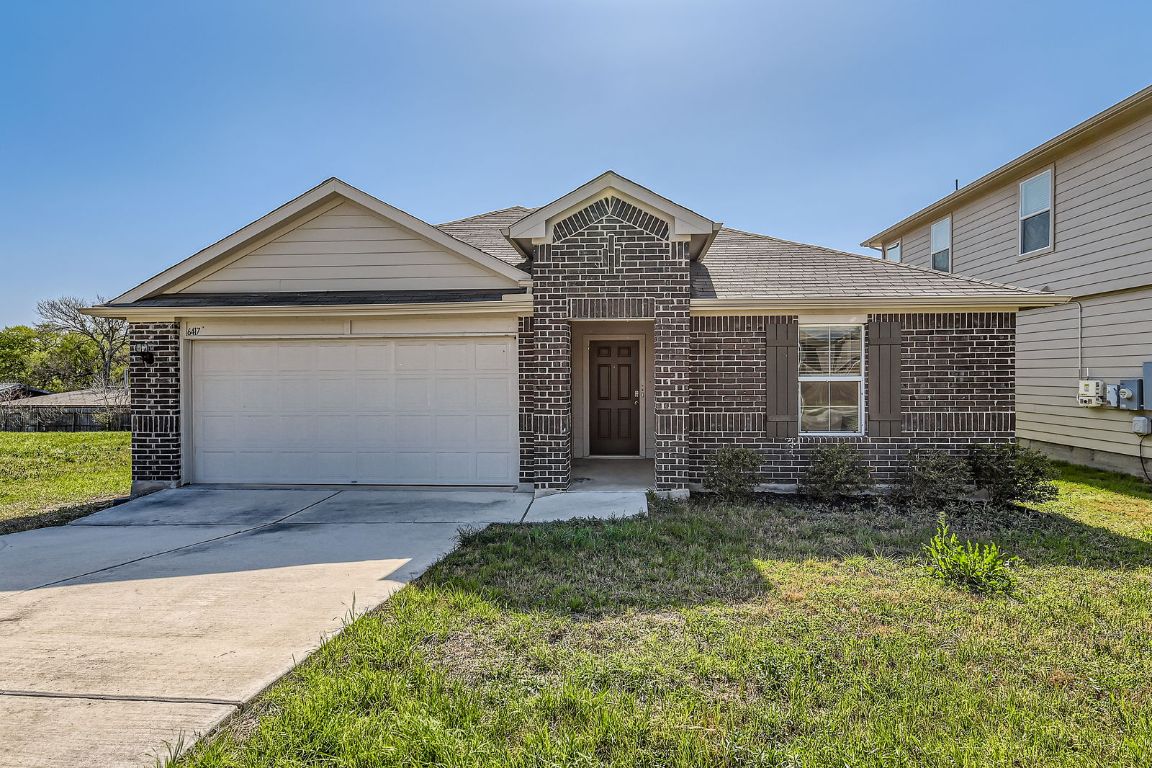 6417 Wideleaf Drive Austin, TX 78724 - Photo 1 of 1 a front view of a house with garden
