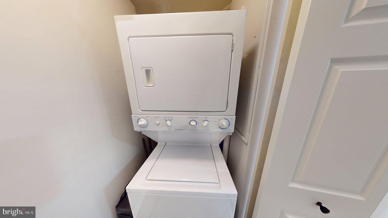 10114 Campus Way South, Unit 201 8C Upper Marlboro, MD 20774 - Photo 13 of 17 a utility room with dryer and washer