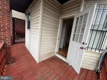 a view of a balcony with wooden floor