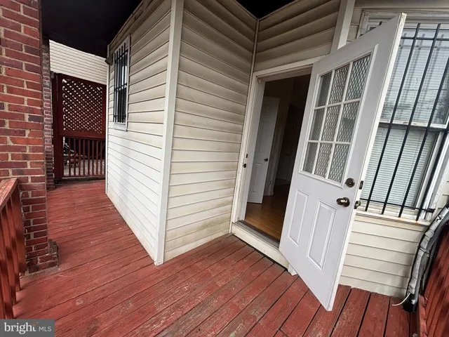 a view of a balcony with wooden floor
