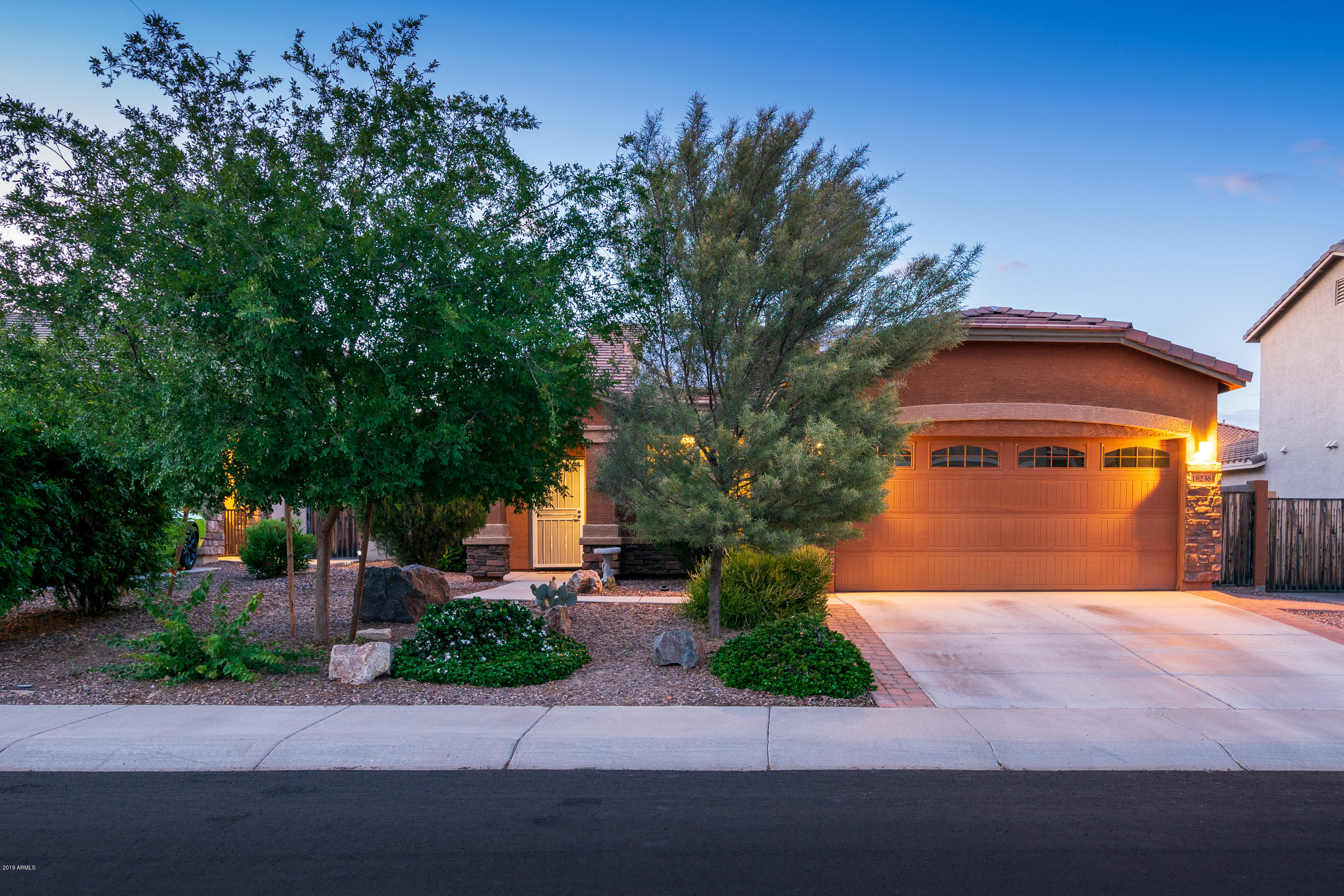 18236 West Hatcher Road Waddell, AZ 85355 - Photo 3 of 38 Evening Front