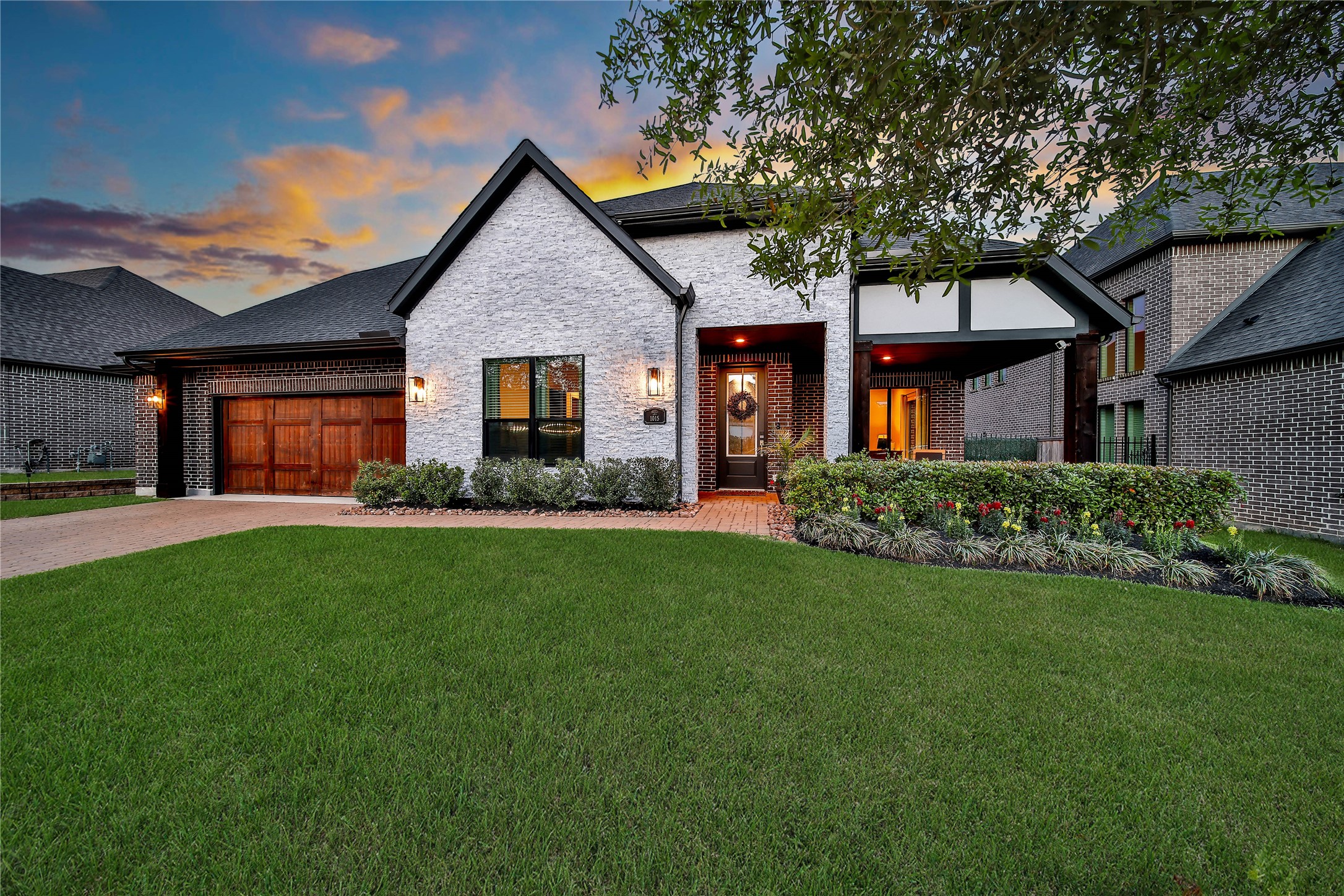 1015 Oak Briar Lane Conroe, TX 77384 - Photo 4 of 50 a front view of a house with a garden and yard