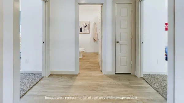 a view of a bathroom with wooden floor
